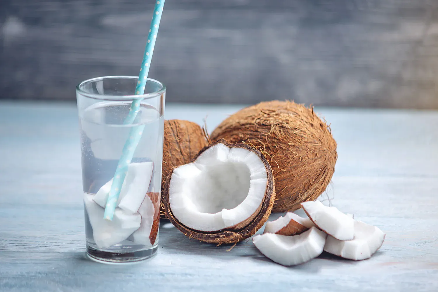 Coconut Water in a glass with raw coconut